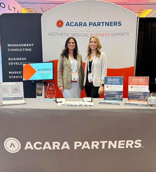 Angela Taylor, VP of Consulting & Practice Development, and Michelle Blydenburg, Director of Business Development at the Acara Partners booth at AmSpa